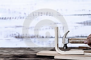 Carpenter working in carpentry shop. Woodwork for furniture and home decor making concept.