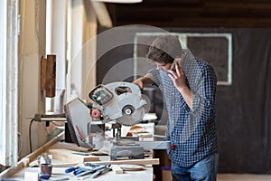 Carpenter working on his craft in a dusty workshop