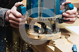 Carpenter Working of Manual Milling Machine in Carpentry Workshop. Industrial Manufactoring Concept.