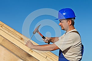 Carpenter working on the roof