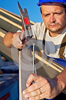 Carpenter working on the roof structure