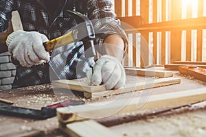 Carpenter working on wood craft at workshop