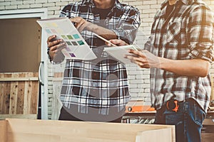 Carpenter working on wood craft at workshop