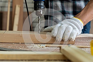 Carpenter working on wood craft at workshop