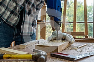 Carpenter working on wood craft at workshop