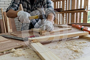 Carpenter working on wood craft at workshop