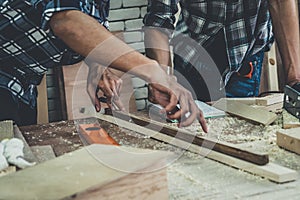 Carpenter working on wood craft at workshop