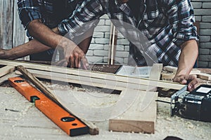 Carpenter working on wood craft at workshop