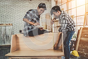 Carpenter working on wood craft at workshop