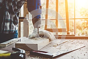 Carpenter working on wood craft at workshop