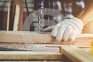 Carpenter working on wood craft at workshop