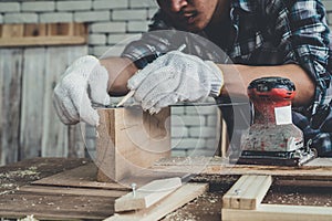 Carpenter working on wood craft at workshop