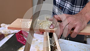 Carpenter working on wood craft at workshop