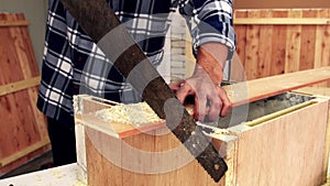 Carpenter working on wood craft at workshop