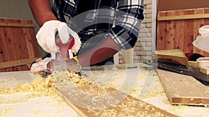 Carpenter working on wood craft at workshop