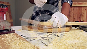 Carpenter working on wood craft at workshop