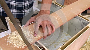 Carpenter working on wood craft at workshop