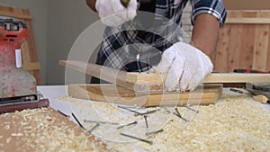 Carpenter working on wood craft at workshop