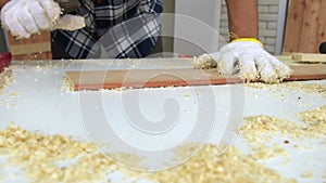 Carpenter working on wood craft at workshop