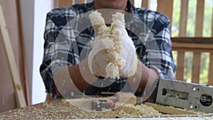 Carpenter working on wood craft at workshop