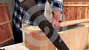 Carpenter working on wood craft at workshop