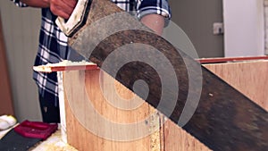 Carpenter working on wood craft at workshop