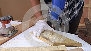 Carpenter working on wood craft at workshop