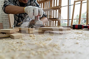 Carpenter working on wood craft at workshop