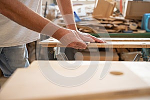 Carpenter working on wood craft at workshop. Professional tools for crafting. DIY maker and carpentry work concept. Copy