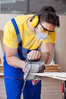 The carpenter working in the workshop