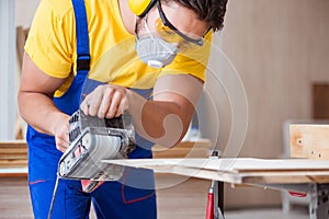 The carpenter working in the workshop
