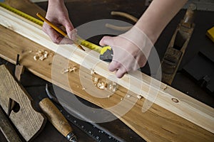 Carpenter working at the workshop. closeup view of carpenter`s h