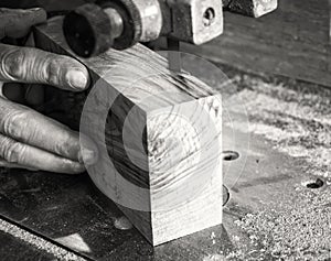 Carpenter workplace- Carpenter workplace. Man using saw to cut wood.