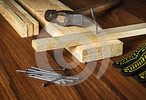 Carpenter workplace tools and wood planks. Working environment in a carpentry workshop
