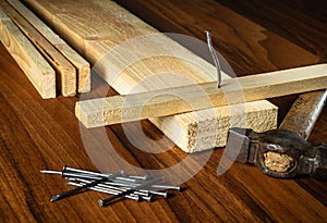 Carpenter workplace tools and wood planks. Working environment in a carpentry workshop