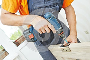 Carpenter works with scredriver