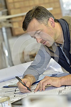 Carpenter at workshop designing