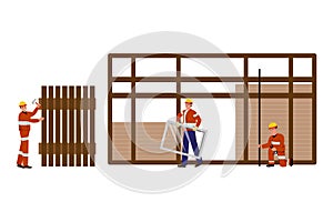 Carpenters In Protective Uniforms and Helmets Framing a Building photo