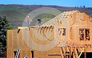 Carpenters Setting Trusses photo