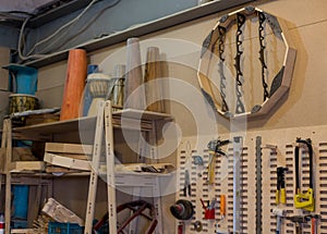 Carpenters tools background. Old fashioned rusty carpenters tools lying under wooden tile boards composition. A hammer