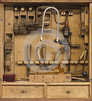 Carpenters tools in a wooden cabinet