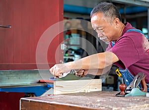 The carpenters are using spokeshave to decorate the woodwork