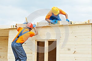 Carpenters at wooden roof work