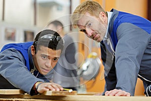 carpentry apprentice shaving wood