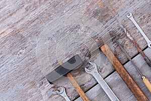 Carpentry and constrution tools on wooden background.