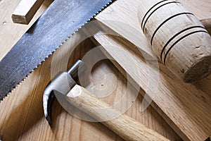 Carpentry hammers and saw photo