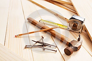 Carpentry tools on wooden background