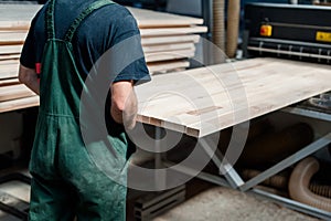 Carpentry worker in a manufacture production