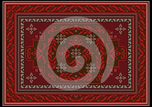 Carpet with ethnic ornament of red and burgundy shades and red floral pattern on brown on the middle