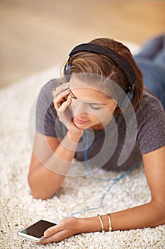Carpet, headphones or woman with phone for music streaming, subscription or wellness in home. Smile, girl or female
